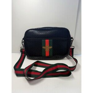 Elegant Black Crossbody Bag with Green and Red Accents
